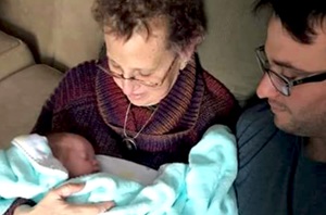 Lung cancer patient, Kim, holding her grandson for the first time